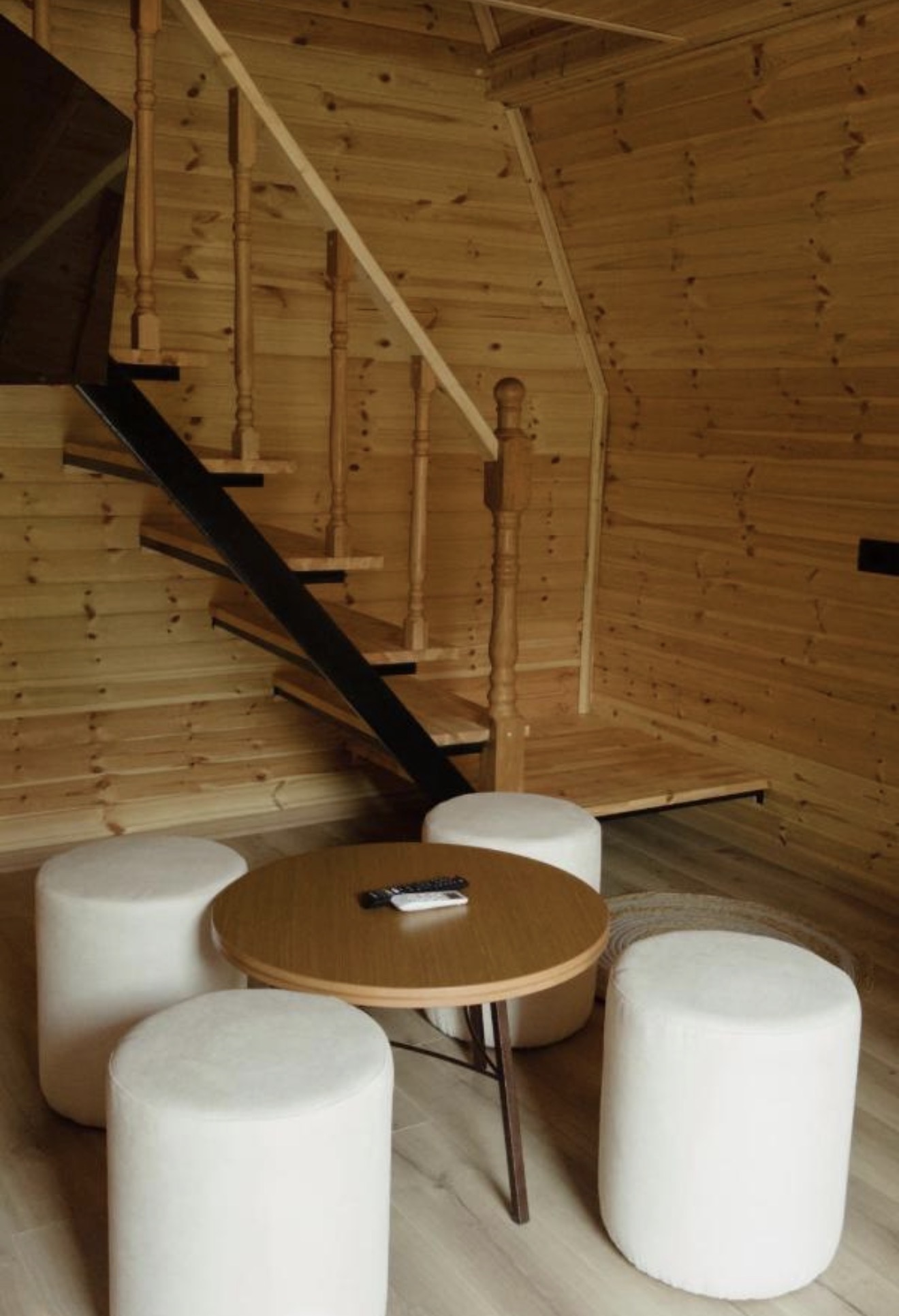 Wooden Villa living space and loft stairs