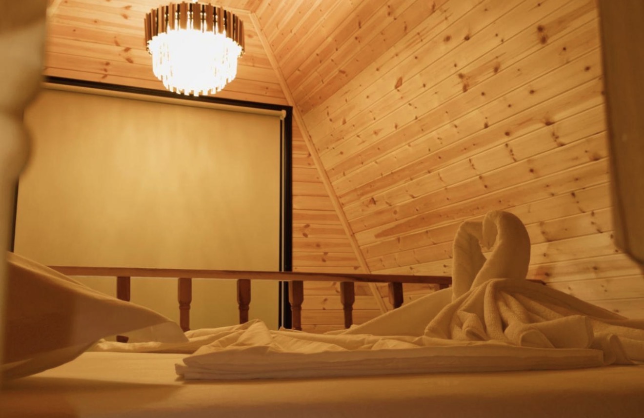 Loft bedroom in a Wooden Villa