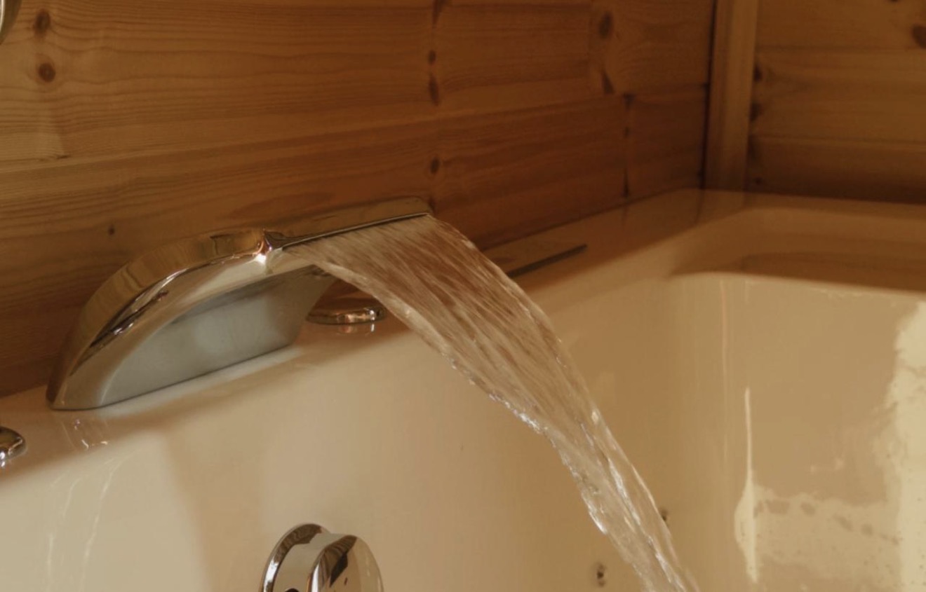 Waterfall tap over villa bathtub